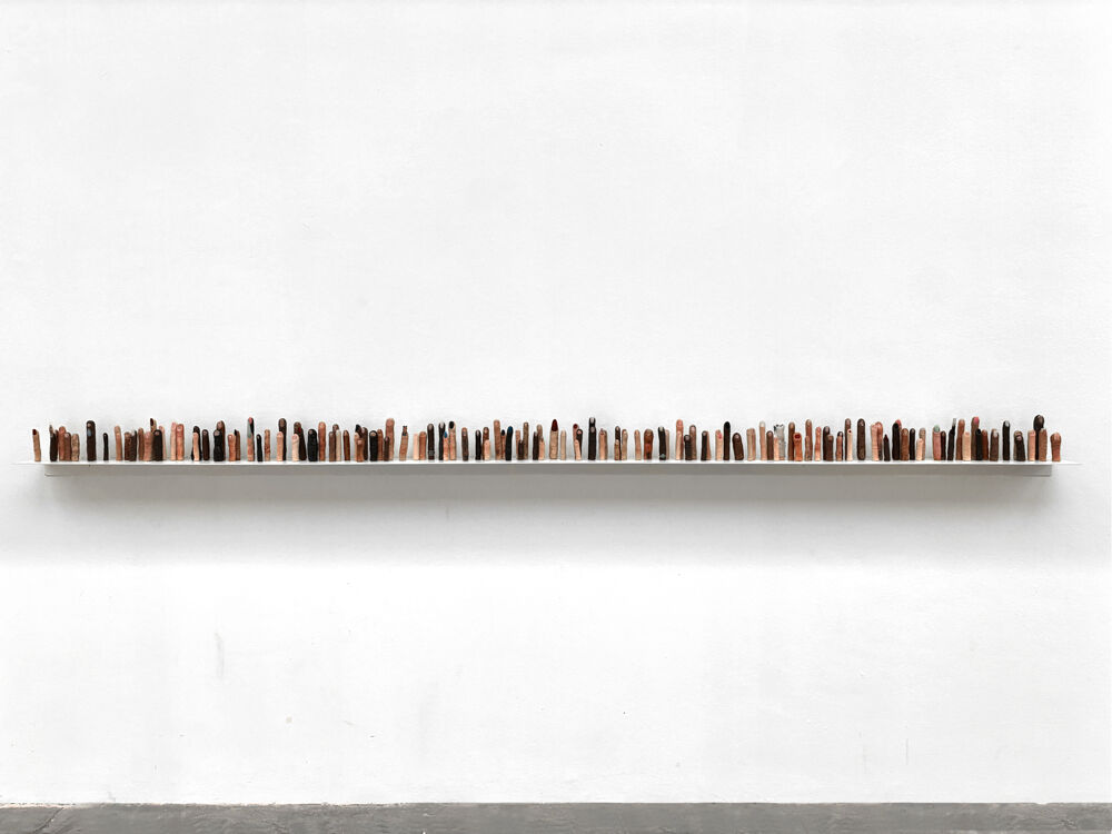 2. Federico Tosi, FRIENDS 2025, 2024, resine, magneti, ripiani in ferro, 300 x 15 x 17 cm, Courtesy the artist